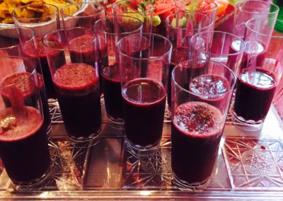 Several glasses on a crystal tray with berry smoothies Wendy Kaplan RD Mondays At Racine