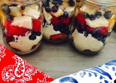 Three mason jars filled with berries and yogurt Wendy Kaplan RD