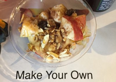 Bowl of Apples and spices with sign reading Make Your Own Apple Nachos Wendy Kaplan, RD at Mondays at Racine